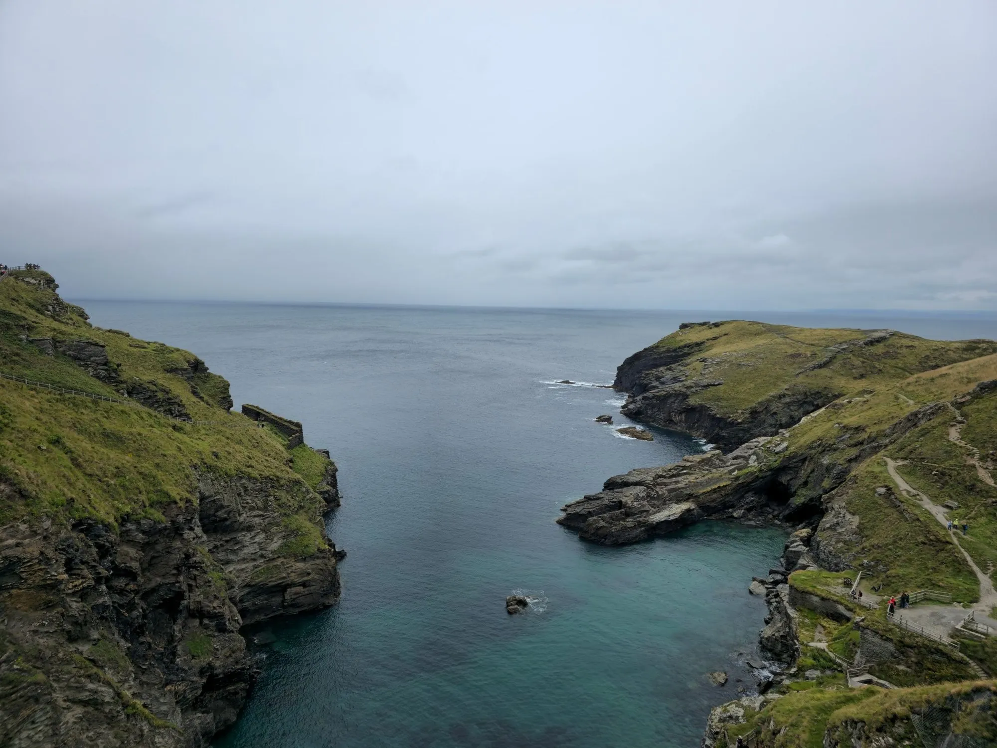 The cove below the house, green cliffs either side of a narrow inlet